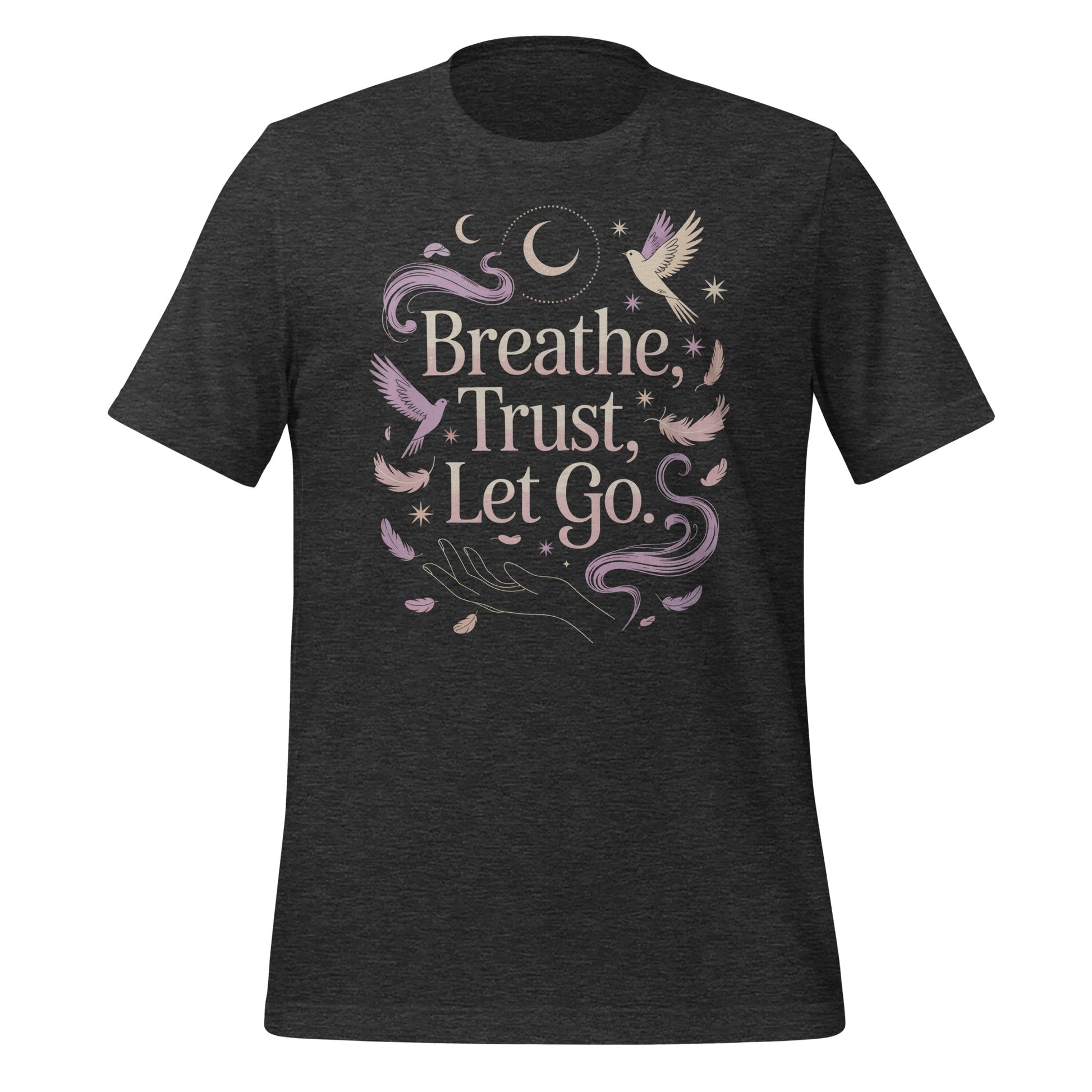 T-shirt unisexe avec un design apaisant affichant le texte "Breathe, Trust, Let Go" (lettres blanches) entouré d’oiseaux, plumes et motifs célestes (lunes, étoiles) en teintes pastel.