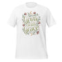 T-shirt unisexe avec un design élégant affichant le texte "Grow with Grace" (lettres vertes) entouré de fleurs (roses, beiges), feuillages verts et motifs célestes (lunes, étoiles).