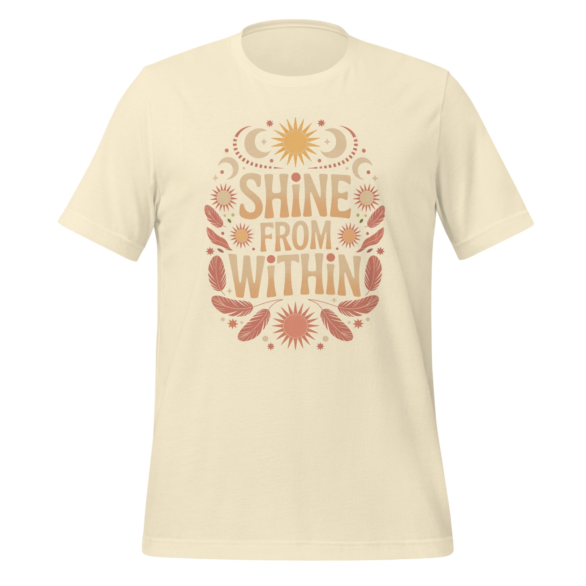 T-shirt unisexe avec un design positif affichant le texte "Shine From Within" (lettres orangées) entouré de motifs célestes (soleils, lunes, étoiles) et plumes beige et rose.