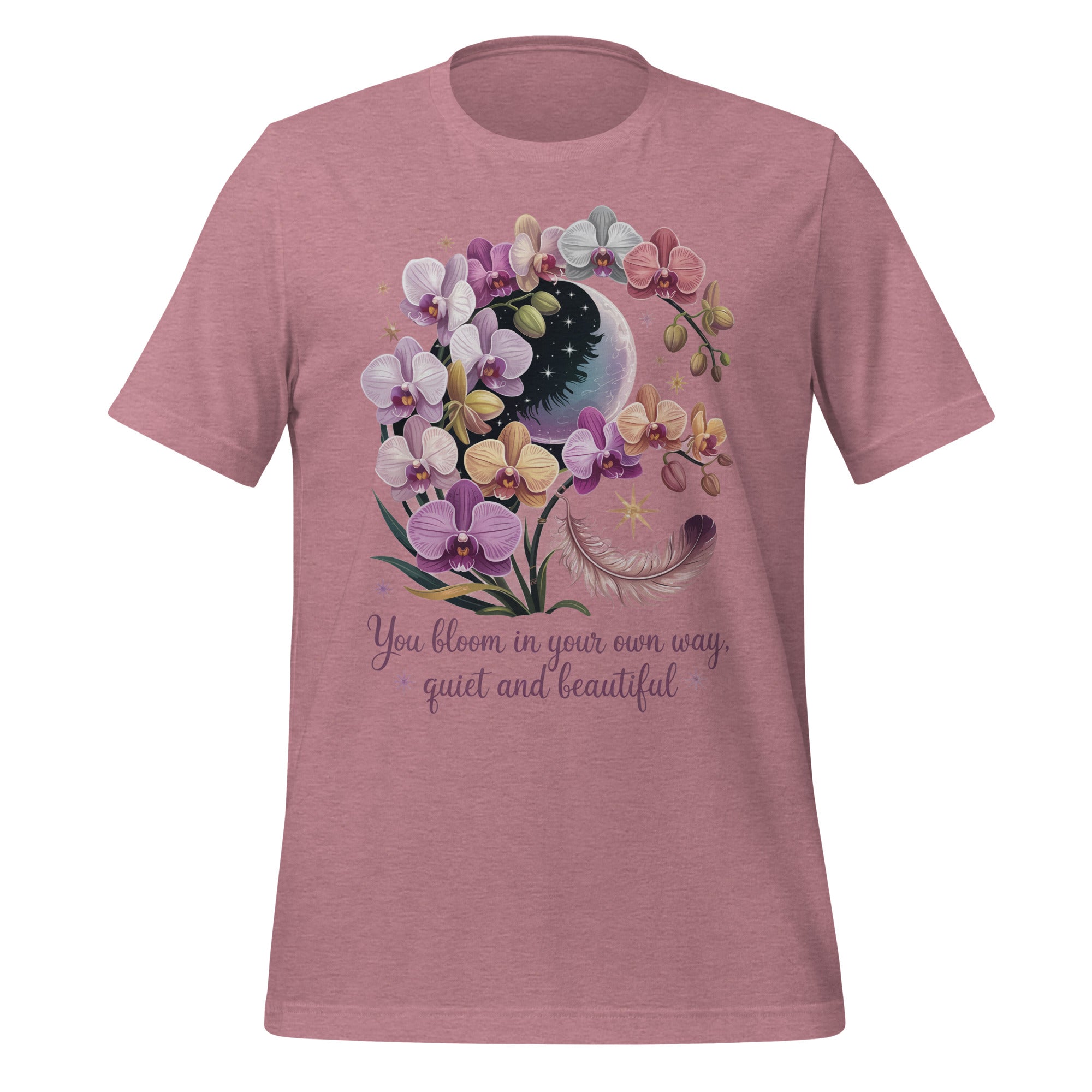 T-shirt unisexe rose avec un design bohème d’orchidées violettes, blanches et roses, une lune étoilée, une plume et le texte "You bloom in your own way, quiet and beautiful".