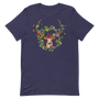 T-shirt bleu marine unisexe avec un design bohème d’un cerf brun clair orné d’une couronne de fleurs multicolores roses, rouges, jaunes et bleues, entouré d’un cadre circulaire doré.