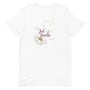 T-shirt blanc unisexe avec un design bohème de pissenlit beige et l’inscription "Just Breathe" en rose.